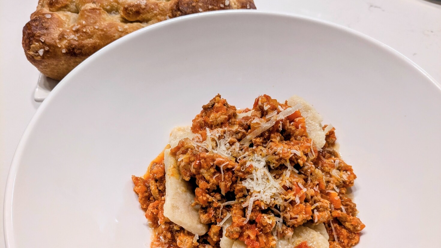 Parmatieddi hand-rolled pasta served with focaccia and ragu sauce